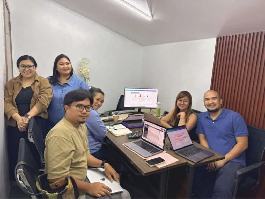 Operations team collaborating around a conference table